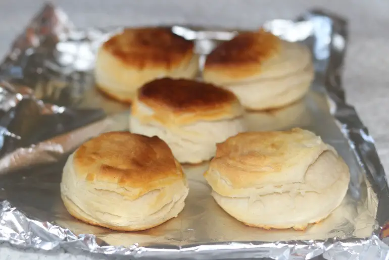 biscuits on an aluminum foil lined baking sheet