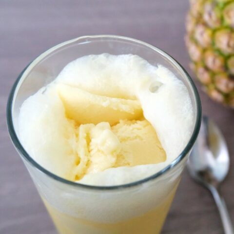 overhead shot of pineapple float with spoon in the background