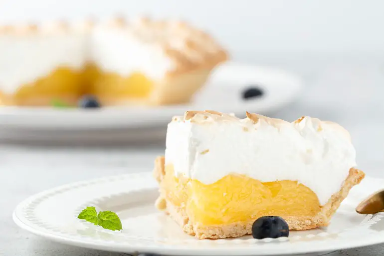 slice of lemon meringue pie on a plate