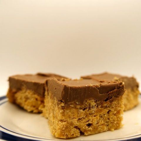 3 scotcheroos on a blue and white plate