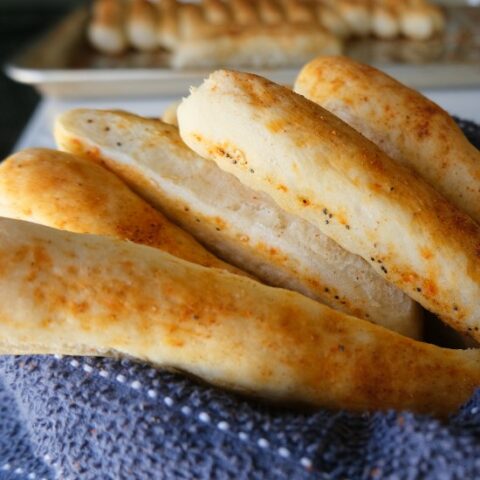 breadsticks on a blue dishcloth