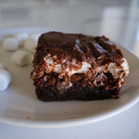 mississippi mud brownie on white plate with marshmallows