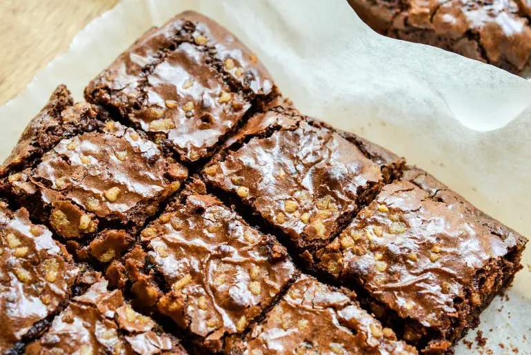 overhead shot of brownies on parchment paper