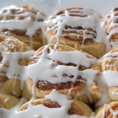 cinnamon rolls in a glass baking pan