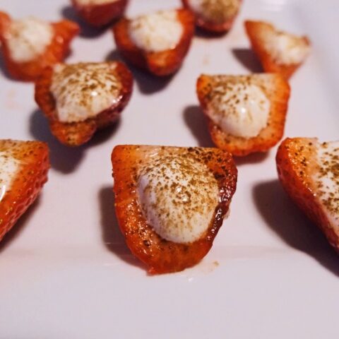 deviled strawberries arranged on a white plate